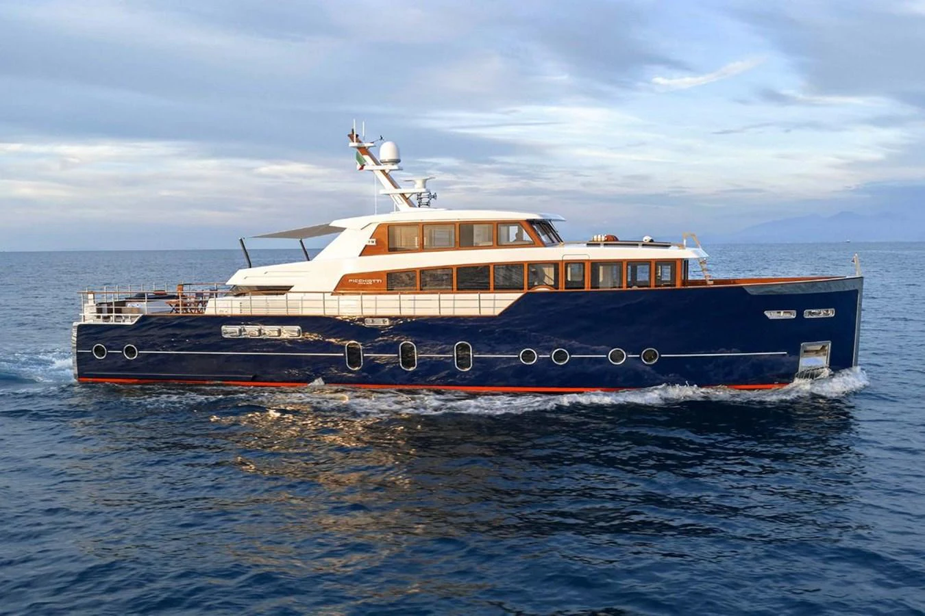 A stunning yacht glides gracefully on the open water, showcasing its sleek design and luxurious features. aboard PICCHIOTTI 24 Yacht for Sale