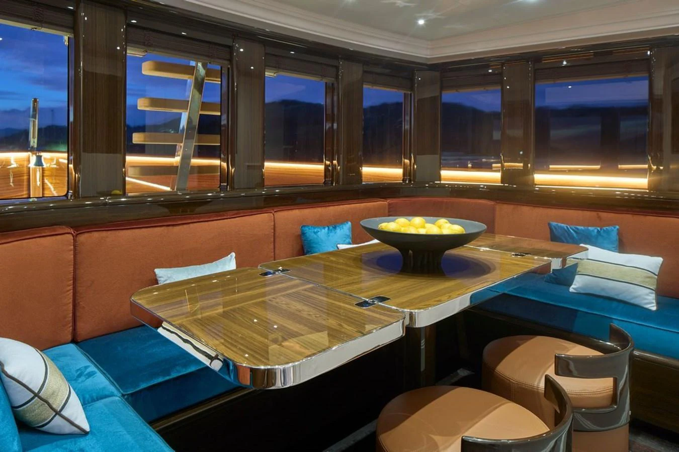 The yacht's dining area features a luxurious table surrounded by plush seating and elegant decor. aboard PICCHIOTTI 24 Yacht for Sale