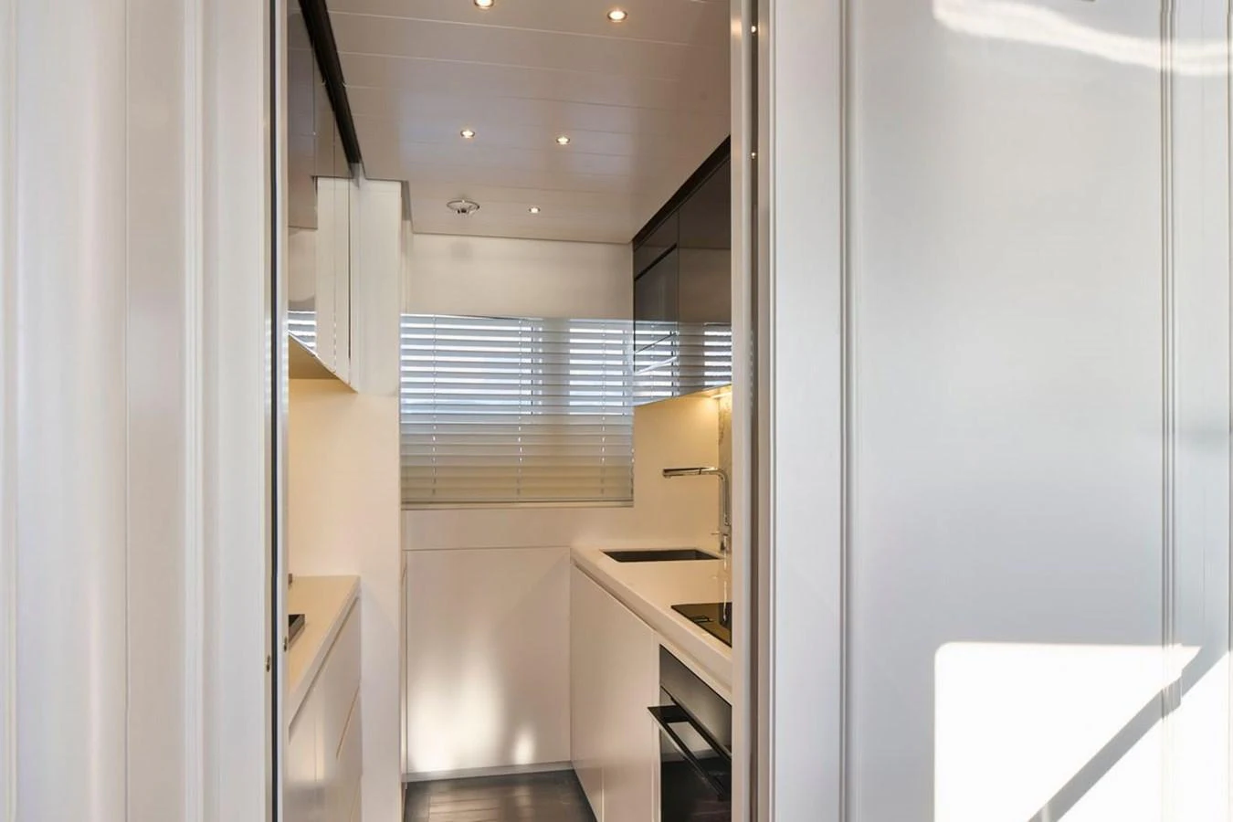 The galley features sleek, modern design with ample natural light and high-end finishes. aboard PICCHIOTTI 24 Yacht for Sale