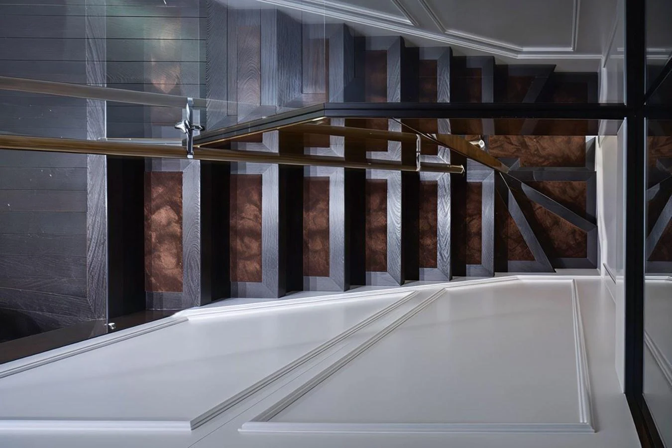 A sleek and modern staircase with glass railings and dark wooden steps exudes sophistication. aboard PICCHIOTTI 24 Yacht for Sale