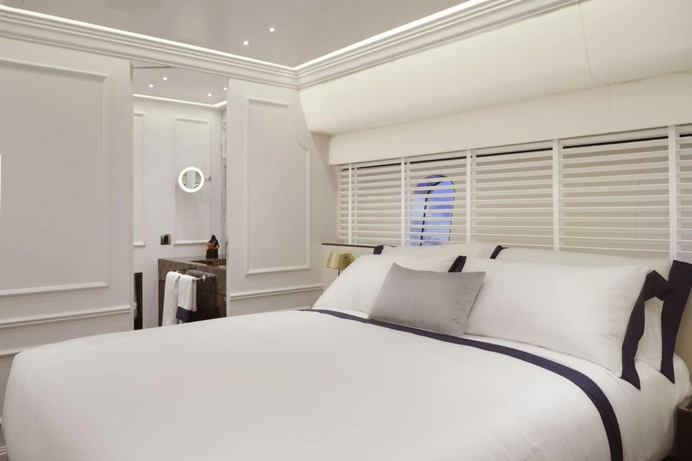 A luxurious stateroom with a large bed and elegant decor. aboard PICCHIOTTI 24 Yacht for Sale