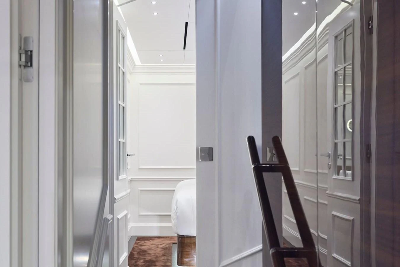 A sleek and modern hallway leading to a cozy stateroom. aboard PICCHIOTTI 24 Yacht for Sale