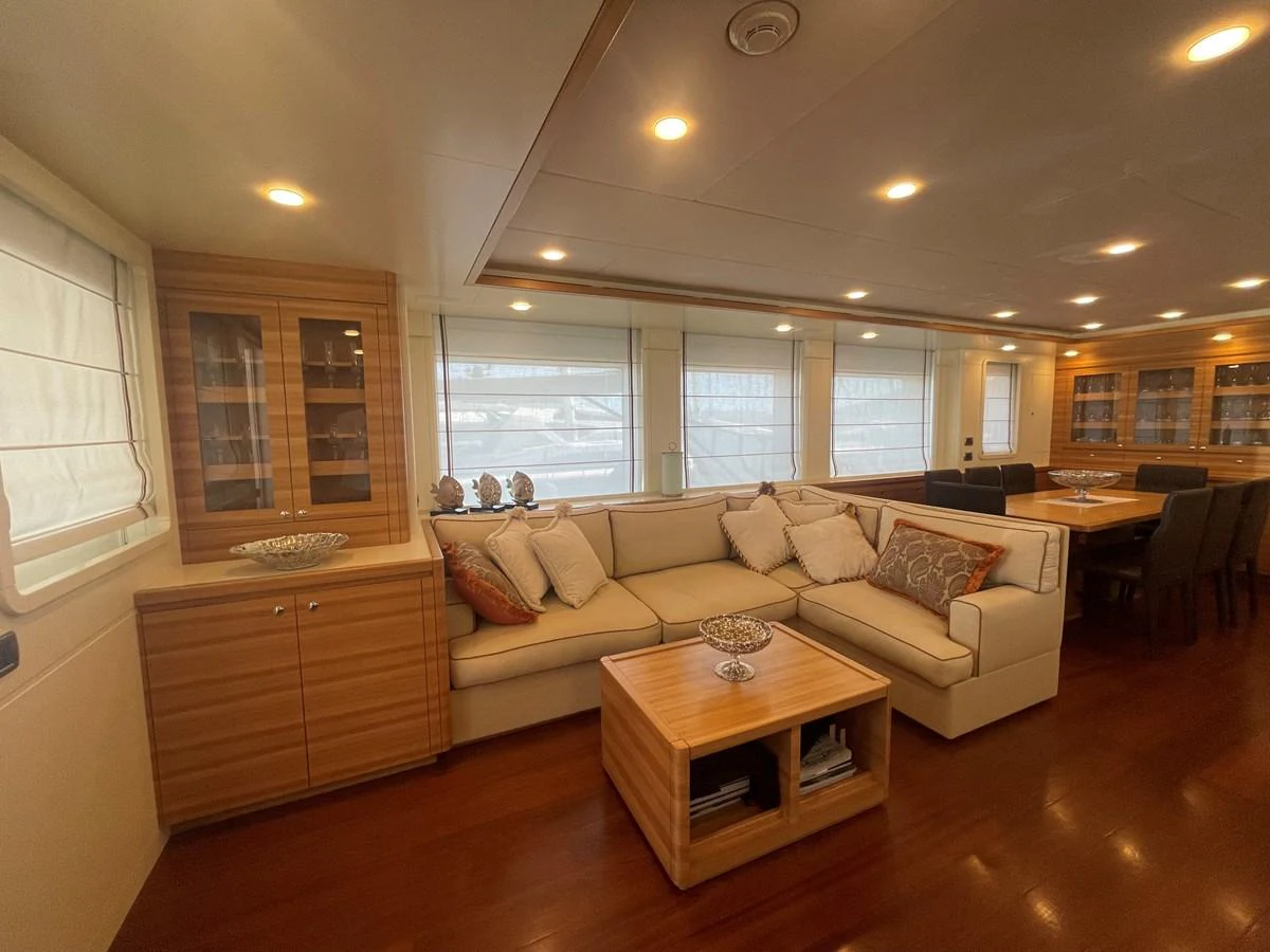 The yacht's salon features a comfortable seating area with elegant decor and ample natural light. aboard STELLA DEL NORD Yacht for Sale