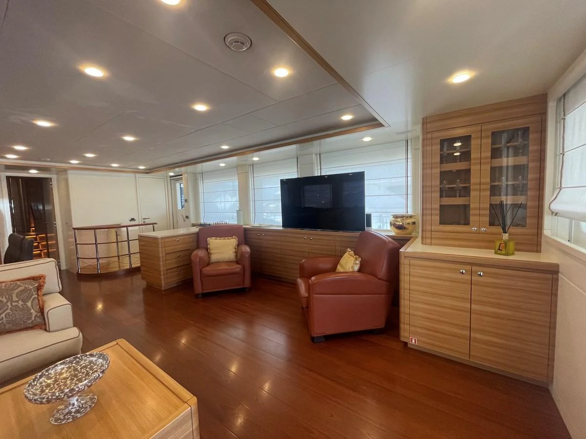The yacht's salon features comfortable seating and elegant wood finishes, creating a warm and inviting atmosphere. aboard STELLA DEL NORD Yacht for Sale
