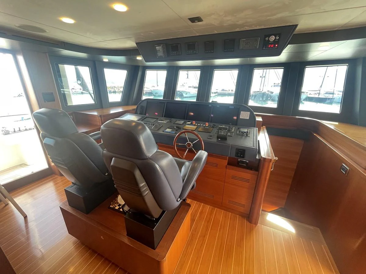 The helm station features a sophisticated control panel with plush seating and expansive windows for optimal navigation. aboard STELLA DEL NORD Yacht for Sale