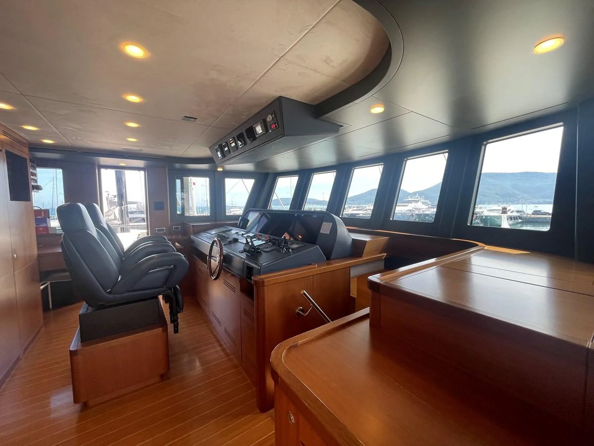 The helm station features a sleek design with modern navigation equipment and comfortable seating. aboard STELLA DEL NORD Yacht for Sale