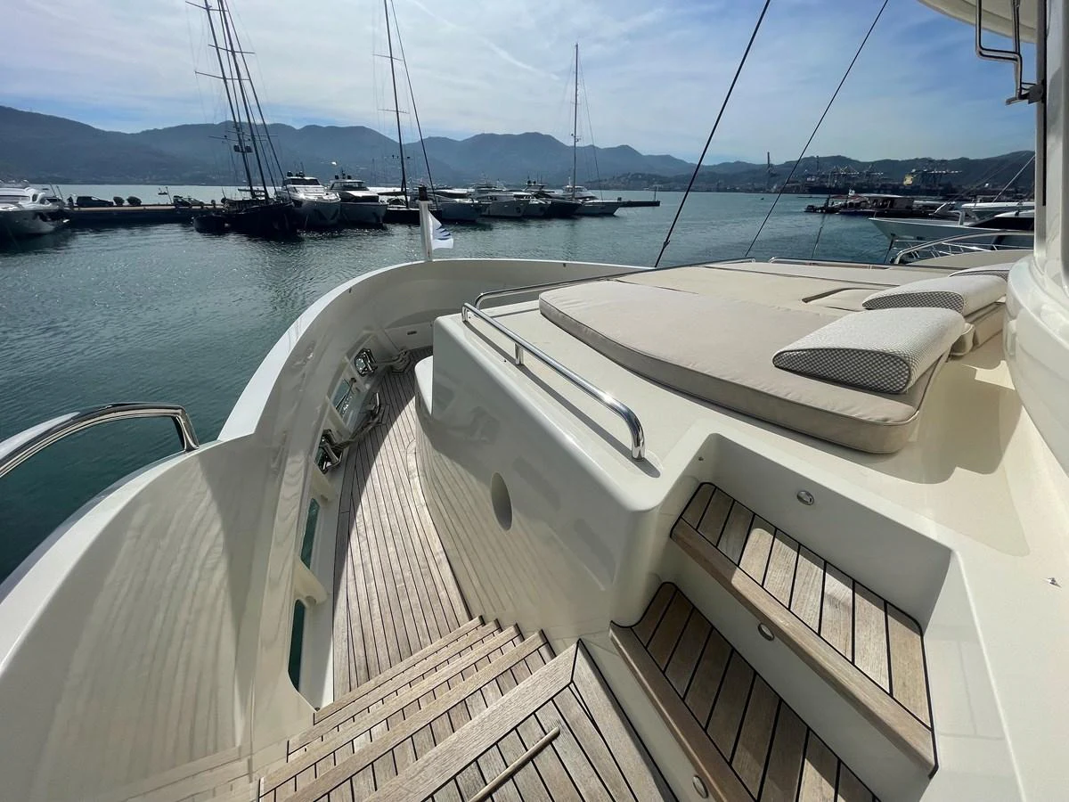 The aft deck offers a serene space with comfortable seating and a view of the marina. aboard STELLA DEL NORD Yacht for Sale
