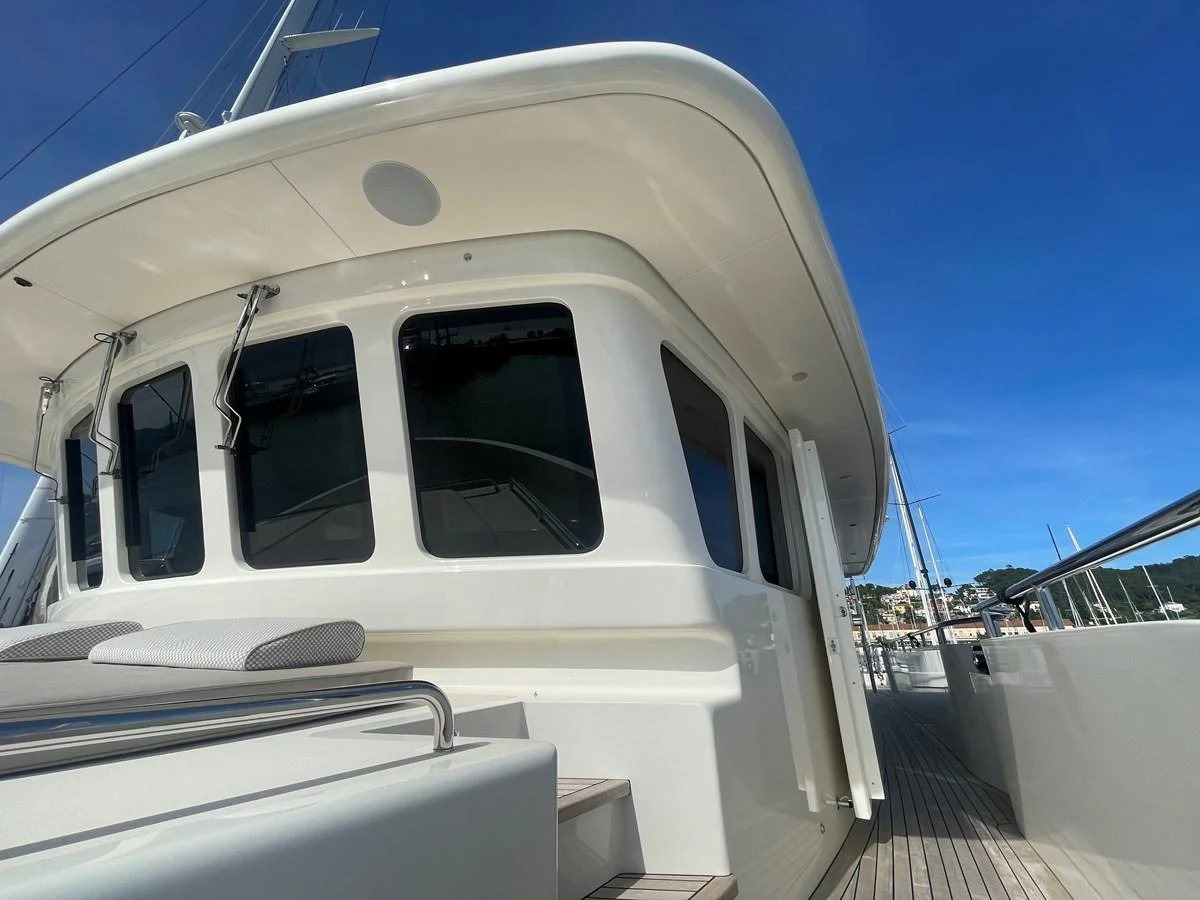 The yacht's sleek exterior showcases modern design and expansive windows. aboard STELLA DEL NORD Yacht for Sale