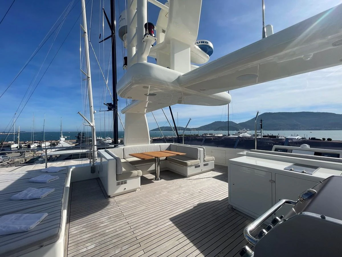 The flybridge offers a spacious and inviting area for relaxation and dining with stunning views of the marina. aboard STELLA DEL NORD Yacht for Sale