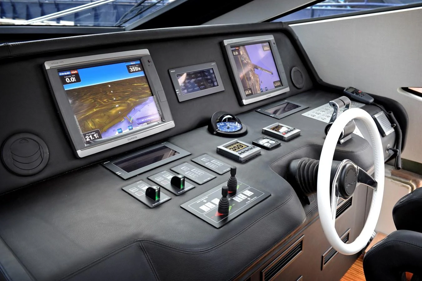The helm features advanced navigation systems and a sleek, modern design. aboard SARNICO GRANDE HULL #3 Yacht for Sale