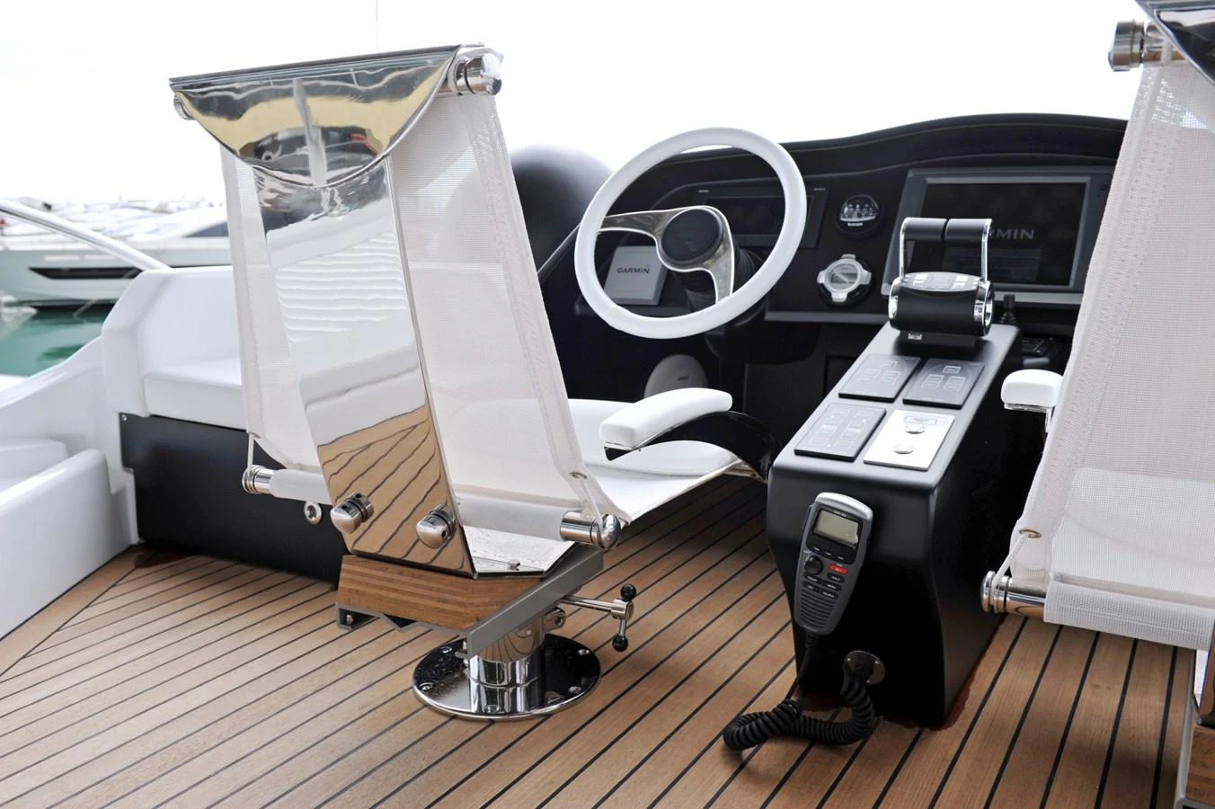 The helm station features modern navigation equipment and sleek seating. aboard SARNICO GRANDE HULL #3 Yacht for Sale