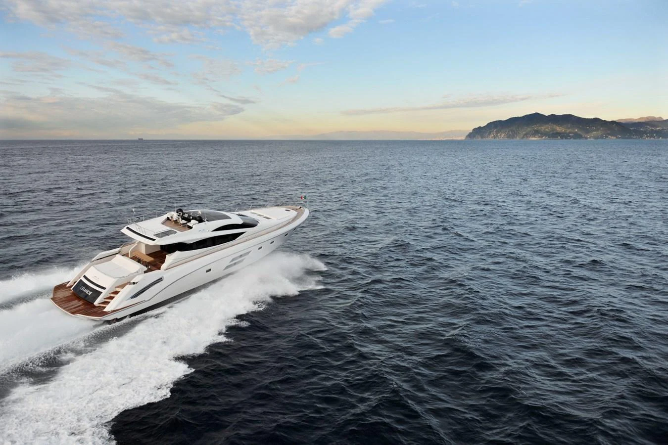 A sleek yacht cruises swiftly across the open sea, showcasing its elegant design and powerful performance. aboard SARNICO GRANDE HULL #3 Yacht for Sale