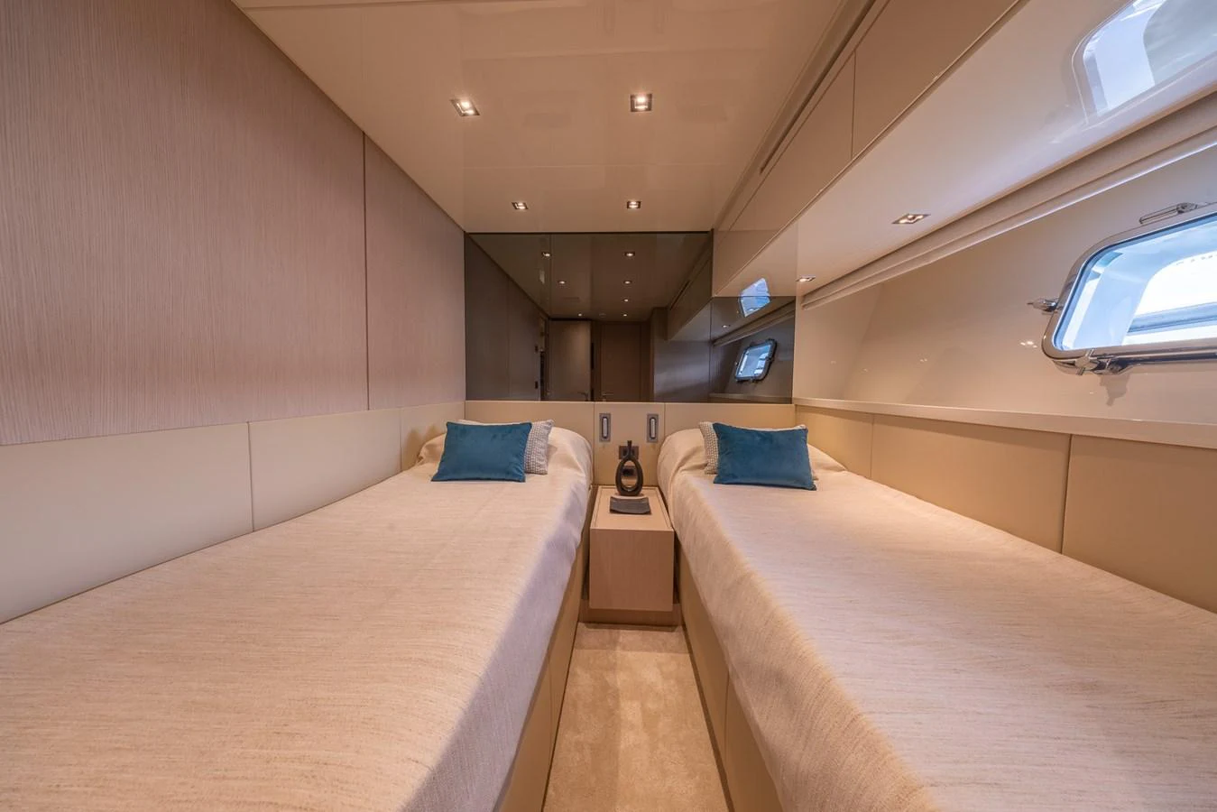 The guest stateroom features twin beds with a modern and elegant design. aboard SX76 #144 Yacht for Sale