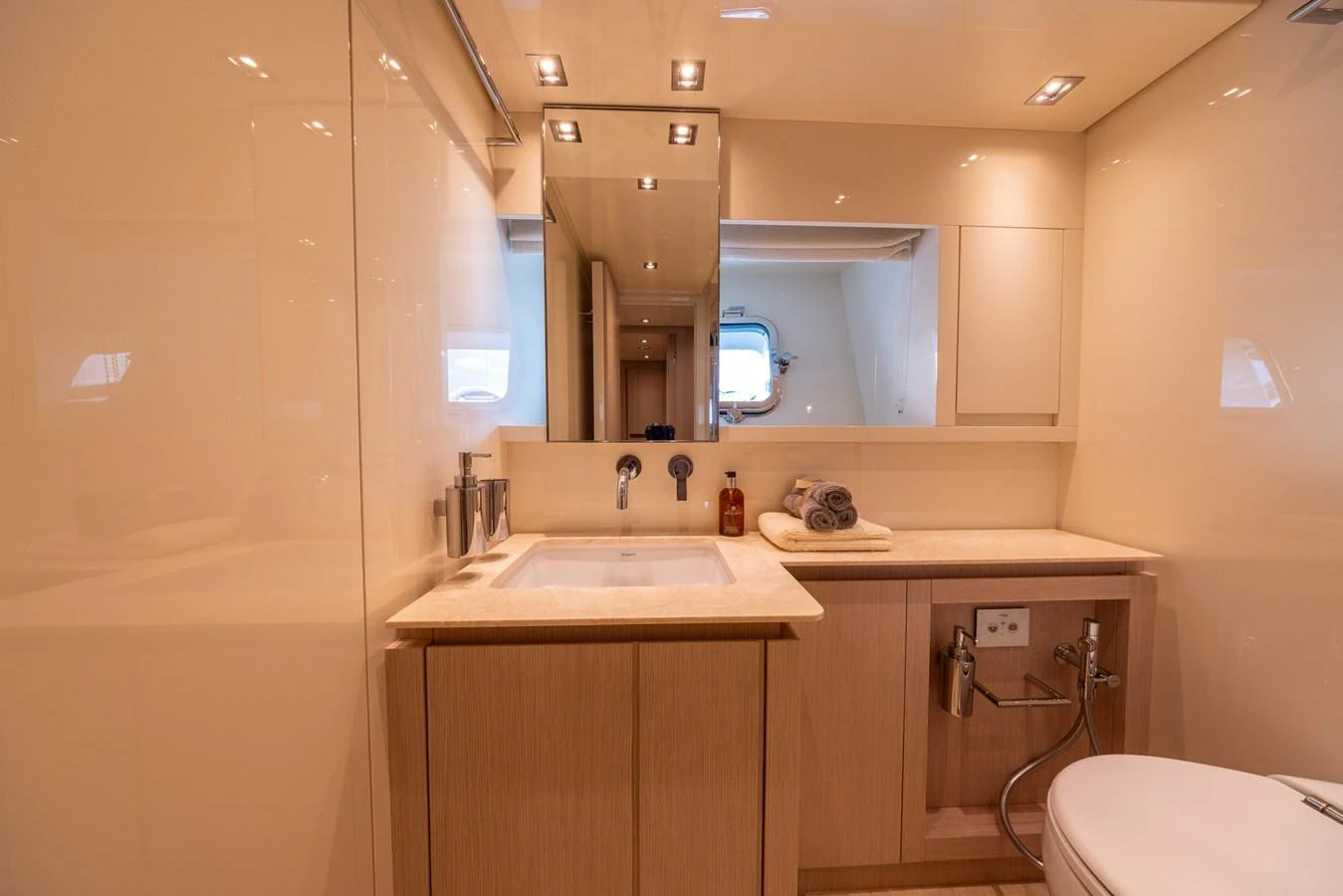 The yacht's bathroom features elegant fixtures and a clean, modern design. aboard SX76 #144 Yacht for Sale
