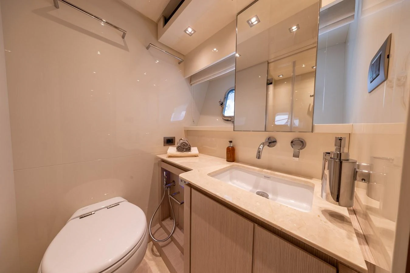 The yacht's bathroom features modern fixtures and a sleek design, providing a luxurious and comfortable space. aboard SX76 #144 Yacht for Sale