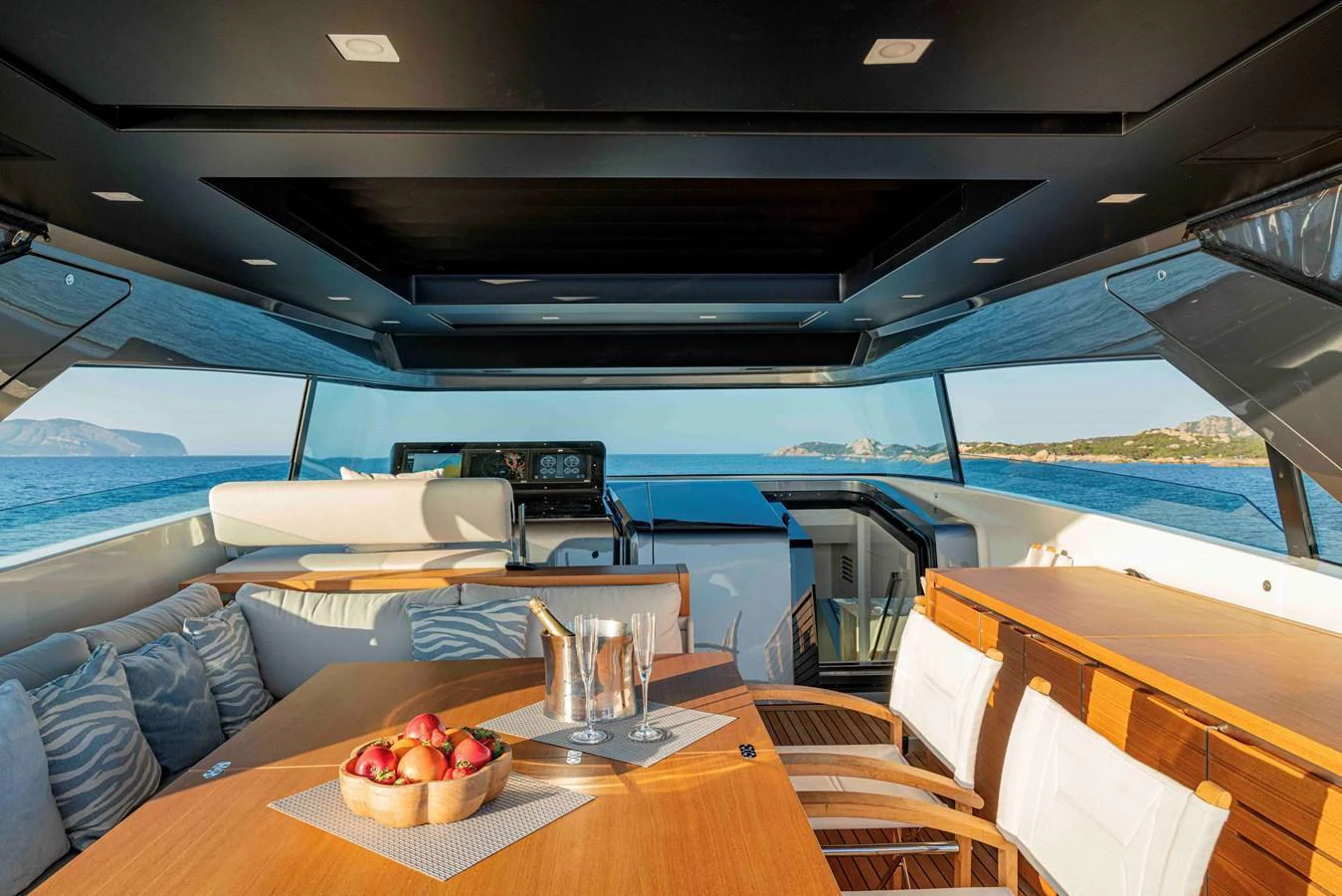 The salon offers a luxurious and inviting space with panoramic views and elegant furnishings. aboard FIREFLY Yacht for Sale