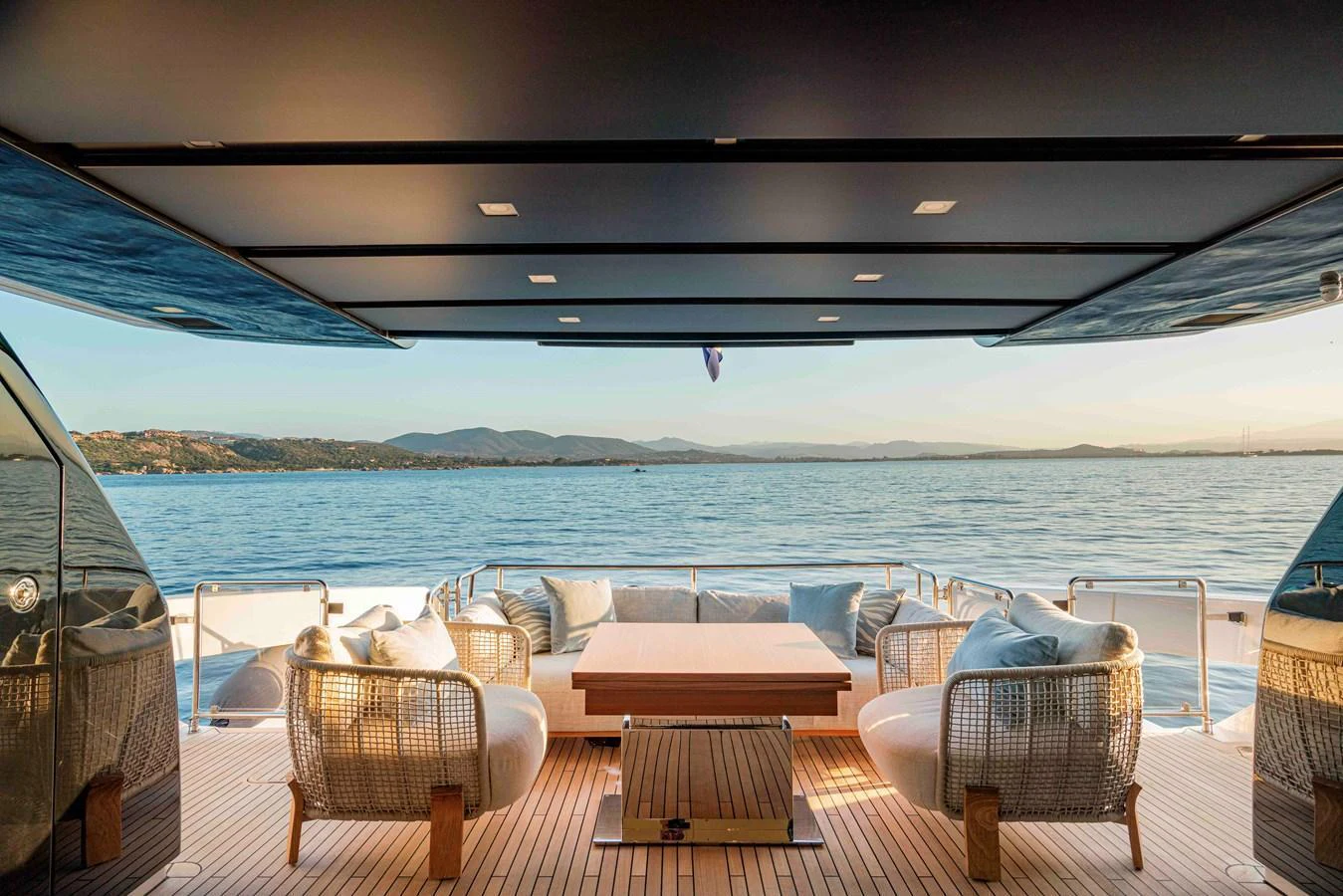 The aft deck offers a luxurious outdoor seating area with stunning views of the water. aboard FIREFLY Yacht for Sale