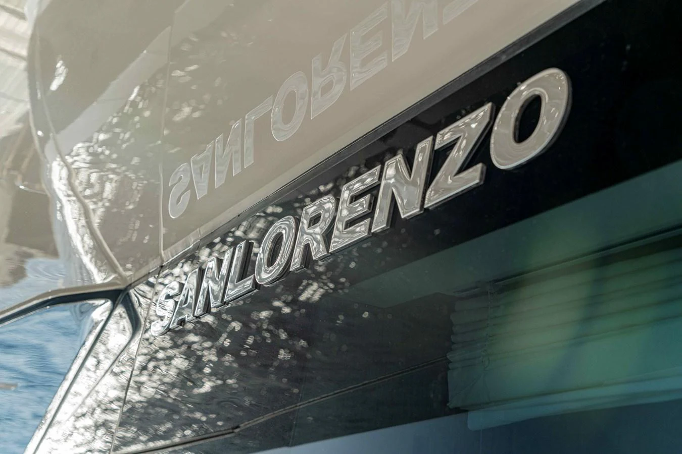 Close-up of the yacht's name displayed on its hull. aboard FIREFLY Yacht for Sale