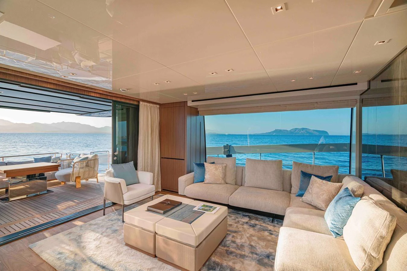The salon offers a spacious and luxurious seating area with panoramic views of the ocean. aboard FIREFLY Yacht for Sale