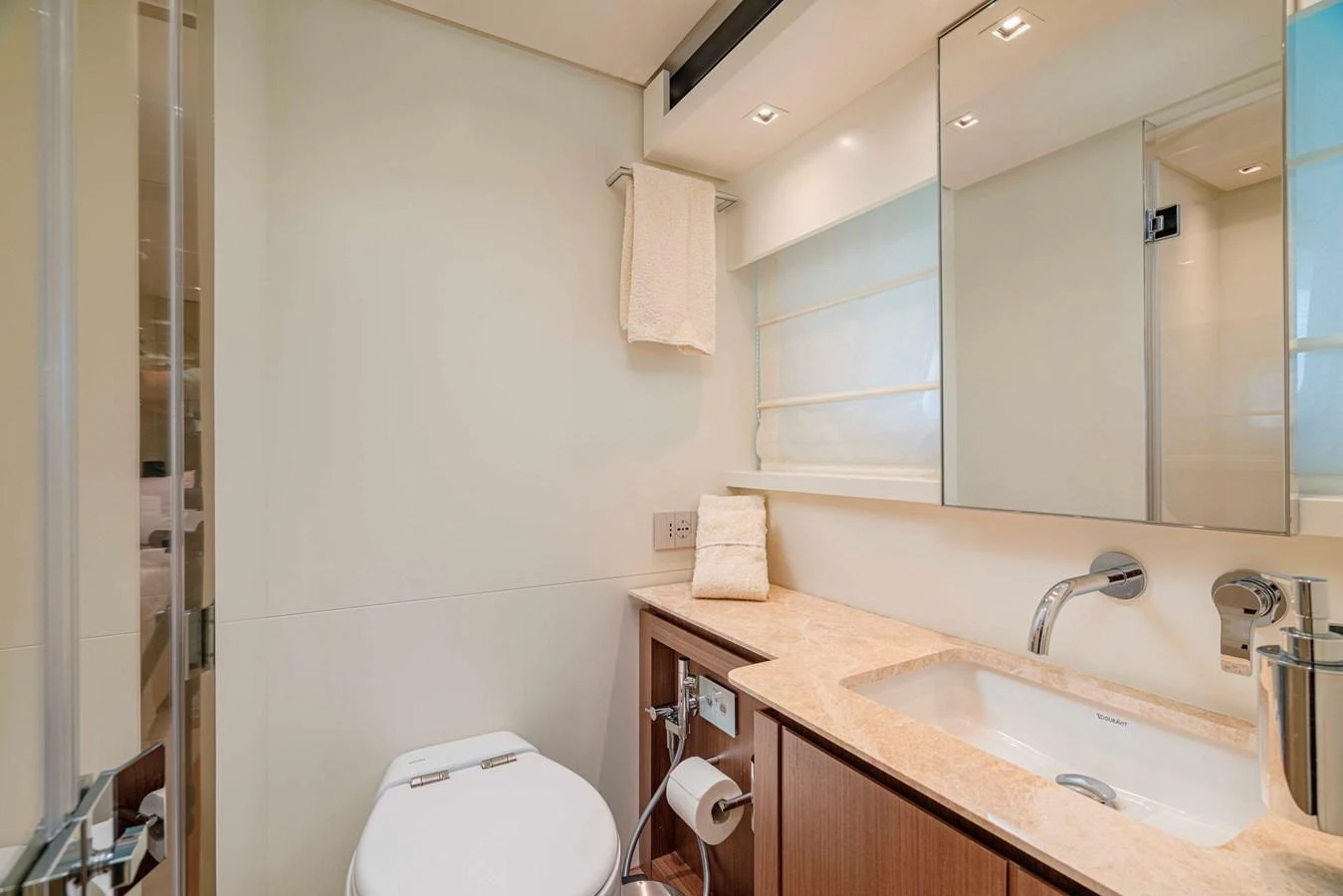 The yacht's bathroom features modern fixtures and a sleek design. aboard FIREFLY Yacht for Sale