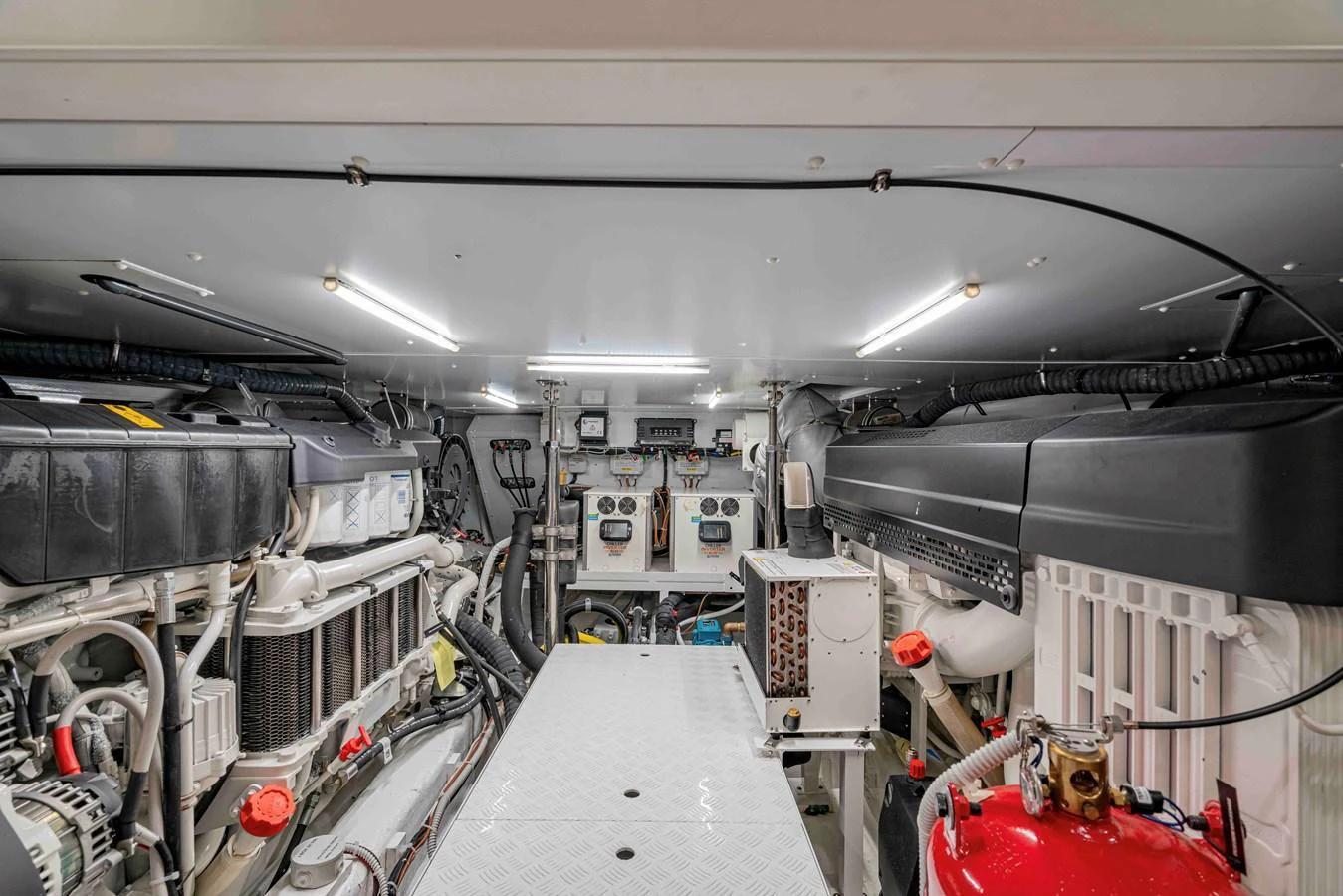 The image showcases the well-organized and clean engine room of the yacht, highlighting its technical sophistication. aboard FIREFLY Yacht for Sale