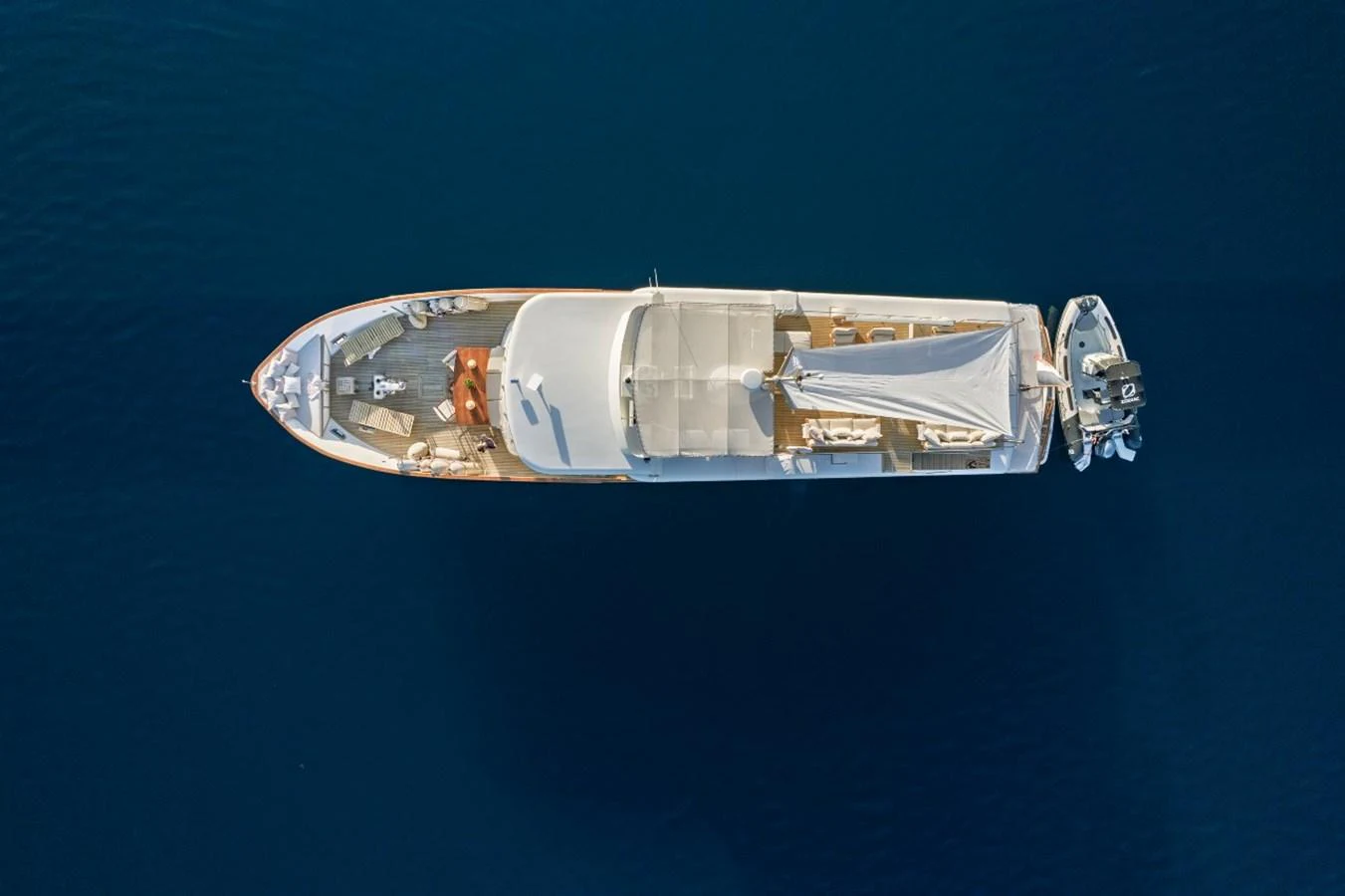 Aerial view of a luxurious yacht cruising on calm blue waters. aboard STALCA Yacht for Sale