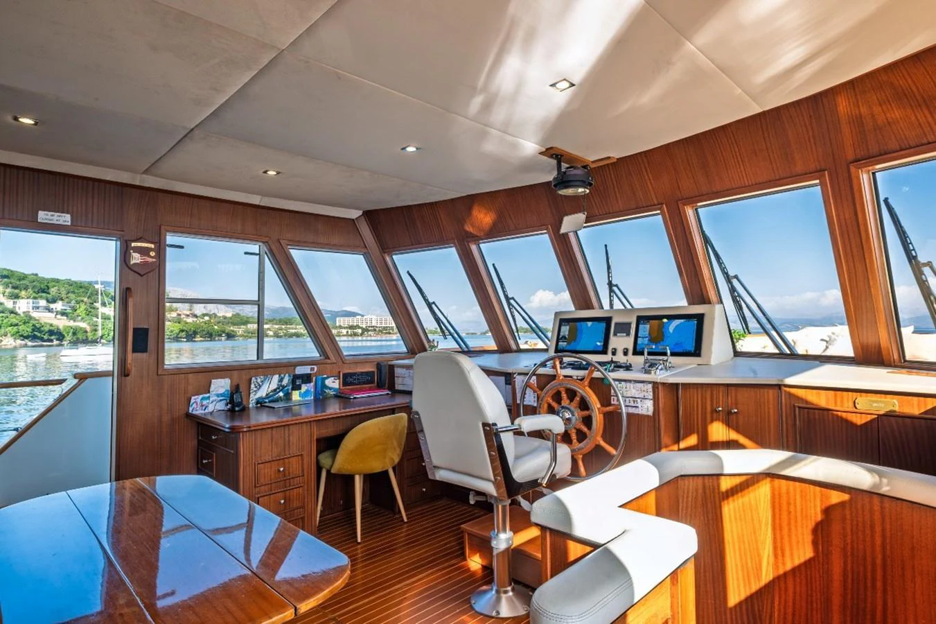 The helm area features a spacious and well-lit control station with panoramic windows offering stunning views. aboard STALCA Yacht for Sale