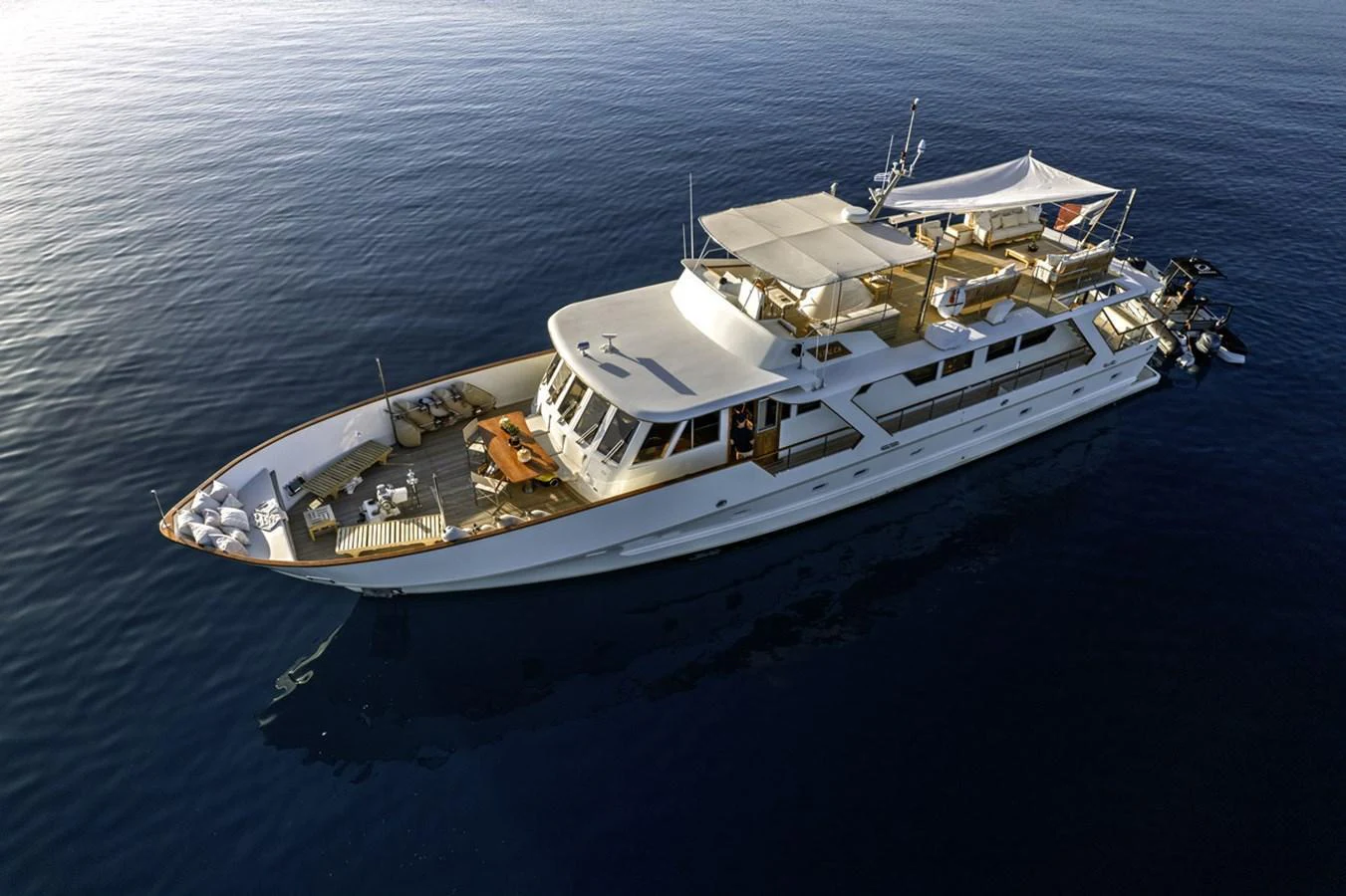 A luxurious yacht glides gracefully on calm waters, showcasing its elegant design and spacious decks. aboard STALCA Yacht for Sale