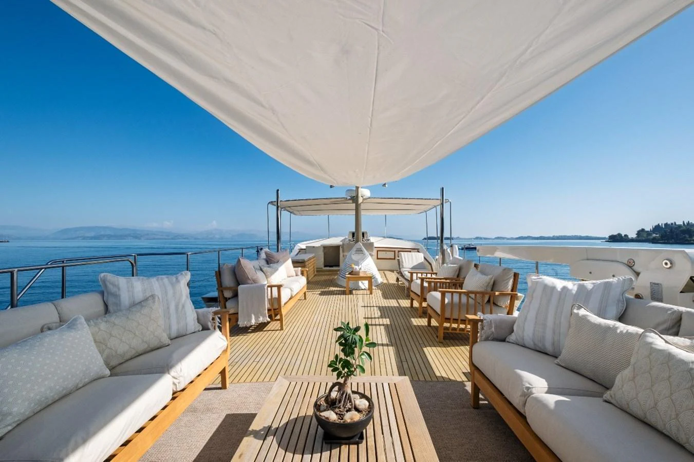 The sundeck offers a spacious and inviting area with comfortable seating and a shaded canopy, perfect for relaxation and enjoying the views. aboard STALCA Yacht for Sale