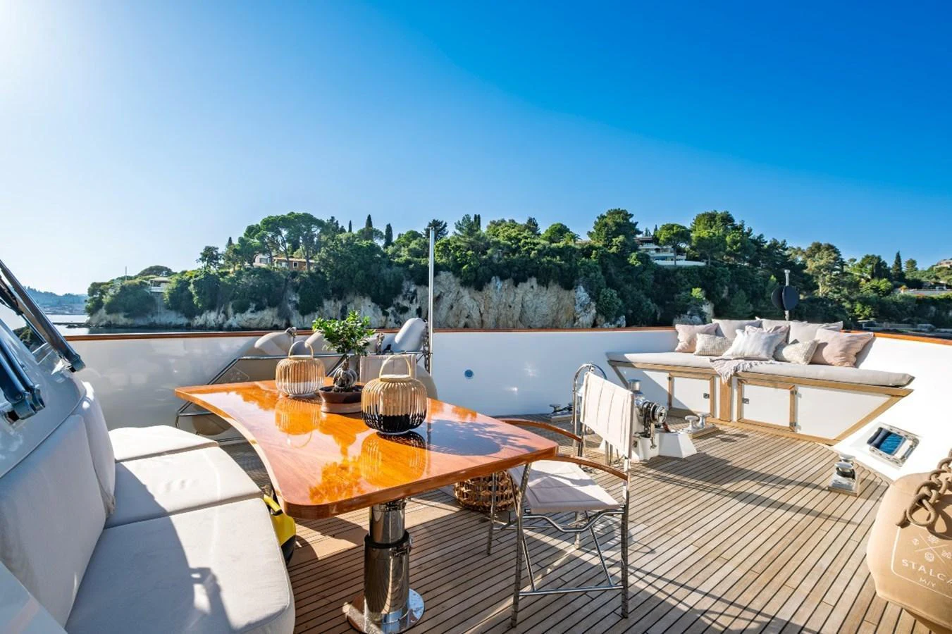The aft deck offers a spacious and inviting area for relaxation and dining with stunning views of the surrounding landscape. aboard STALCA Yacht for Sale