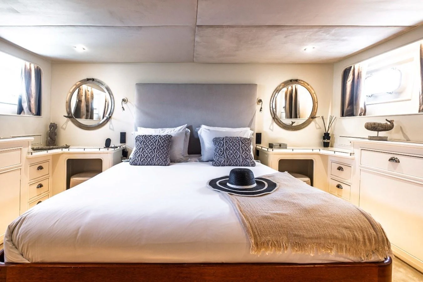 The master stateroom features a plush bed with elegant decor and ample natural light. aboard STALCA Yacht for Sale