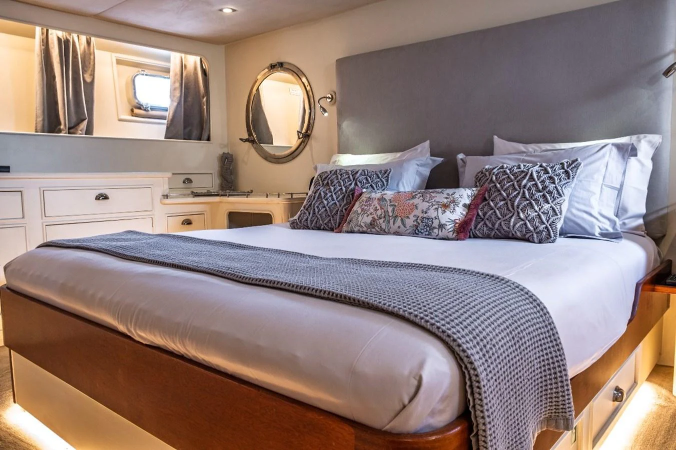 The stateroom features a plush bed with elegant bedding and tasteful decor, creating a cozy and luxurious retreat. aboard STALCA Yacht for Sale