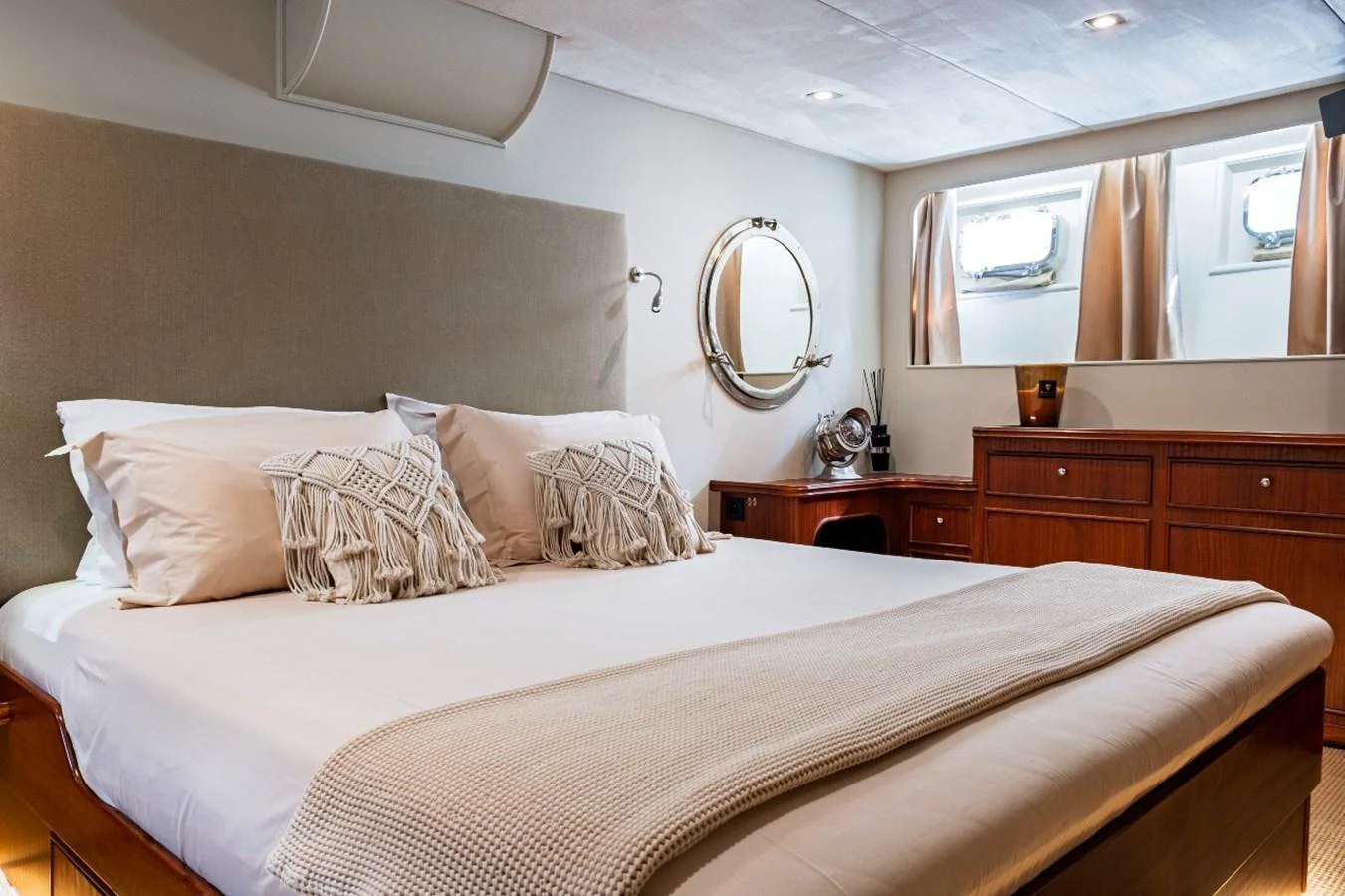 The stateroom features a comfortable bed with elegant decor and ample natural light. aboard STALCA Yacht for Sale