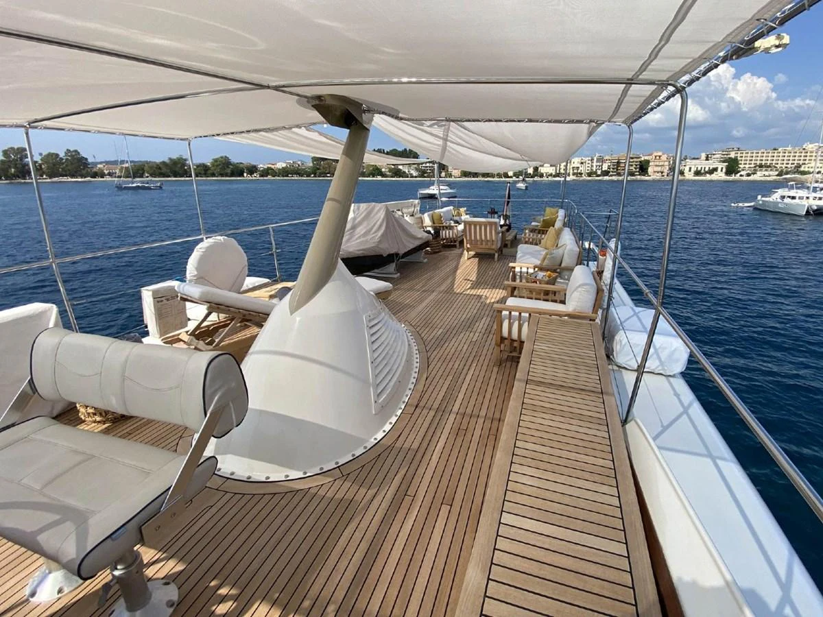 The sundeck offers a spacious and inviting area with ample seating and shade, perfect for relaxation and enjoying the views. aboard STALCA Yacht for Sale