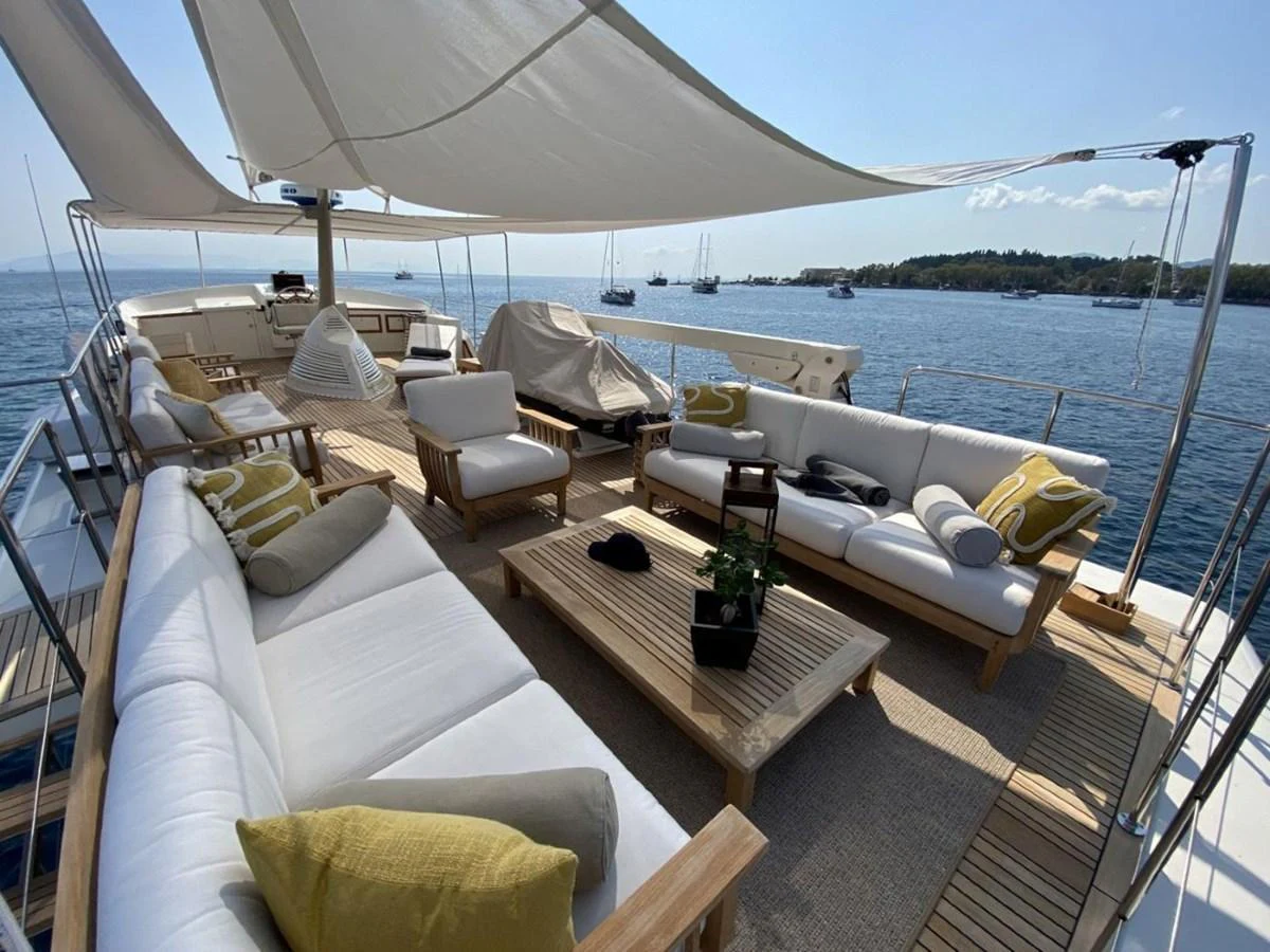 The flybridge offers a spacious and comfortable outdoor lounging area with ample seating and shade. aboard STALCA Yacht for Sale
