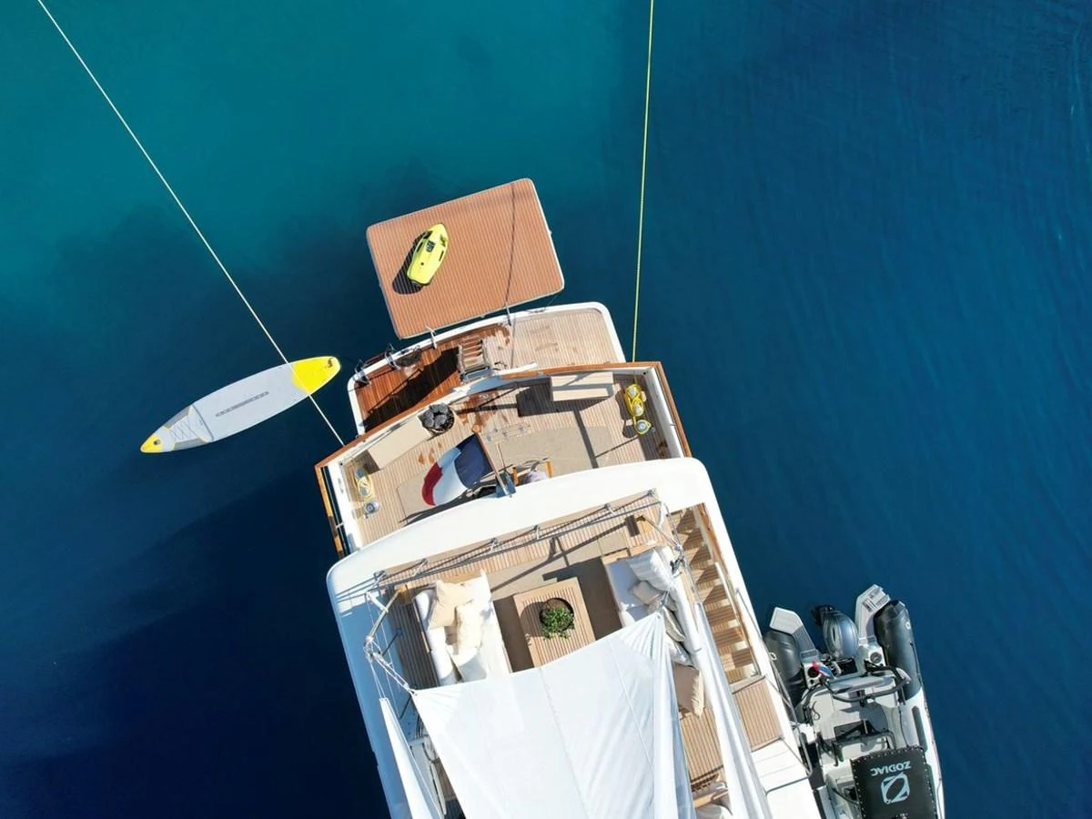 The aft deck of the yacht features a spacious lounging area with water toys ready for adventure. aboard STALCA Yacht for Sale