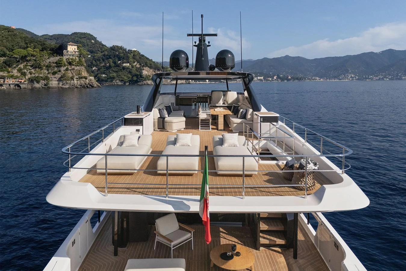 The yacht's sundeck offers ample seating and lounging areas with stunning views of the surrounding waters. aboard INFYNITO 80 Yacht for Sale
