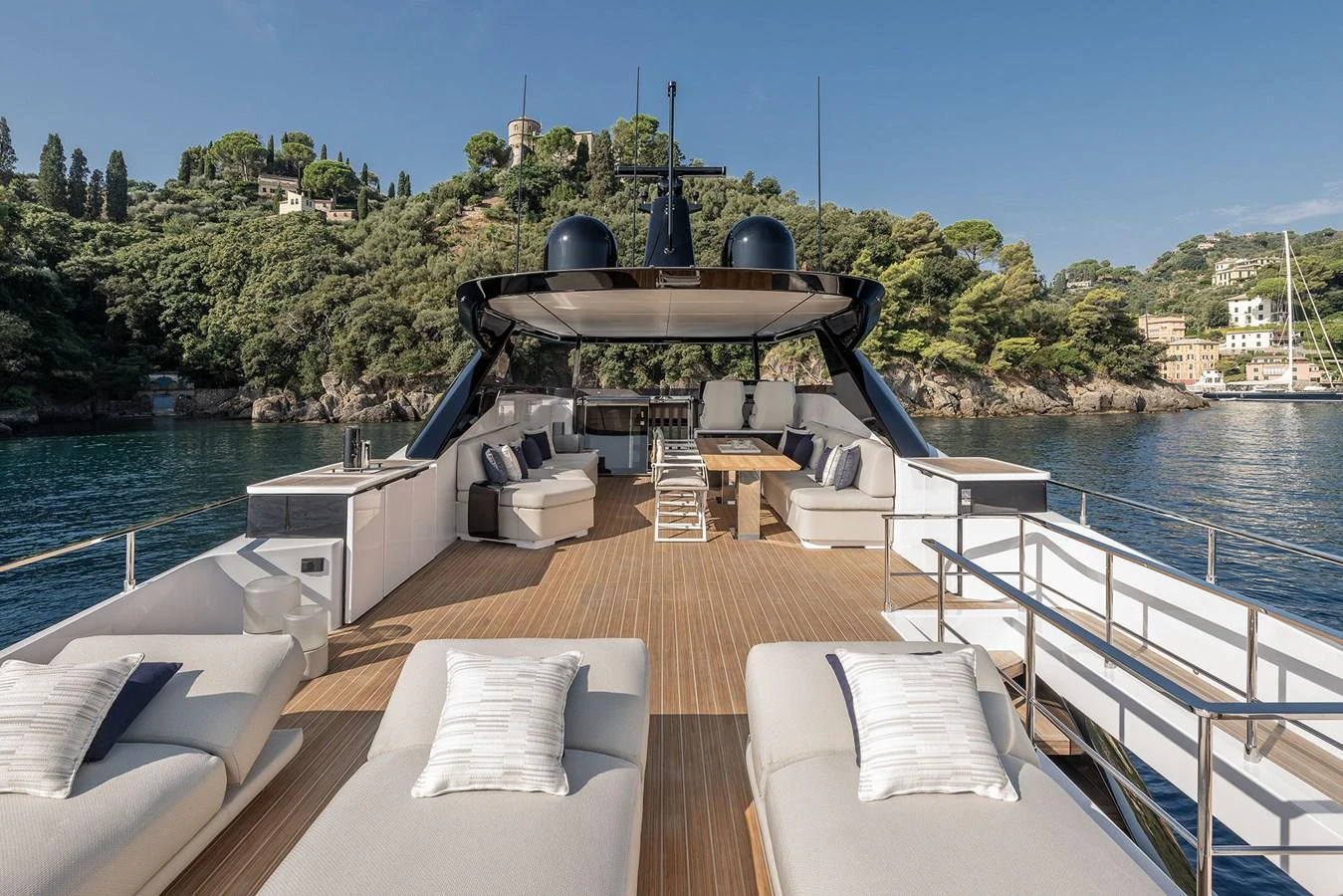 The sundeck offers luxurious lounging areas with plush seating and scenic views. aboard INFYNITO 80 Yacht for Sale