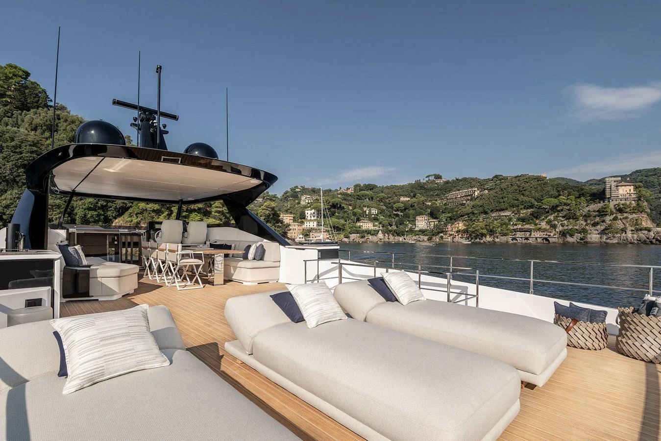 The sundeck offers luxurious lounging with plush sunbeds and scenic views. aboard INFYNITO 80 Yacht for Sale