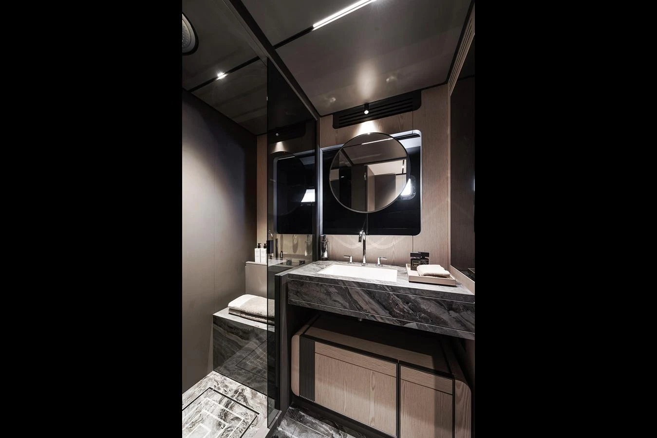 A sleek and modern yacht bathroom with luxurious finishes and ample lighting. aboard INFYNITO 80 Yacht for Sale