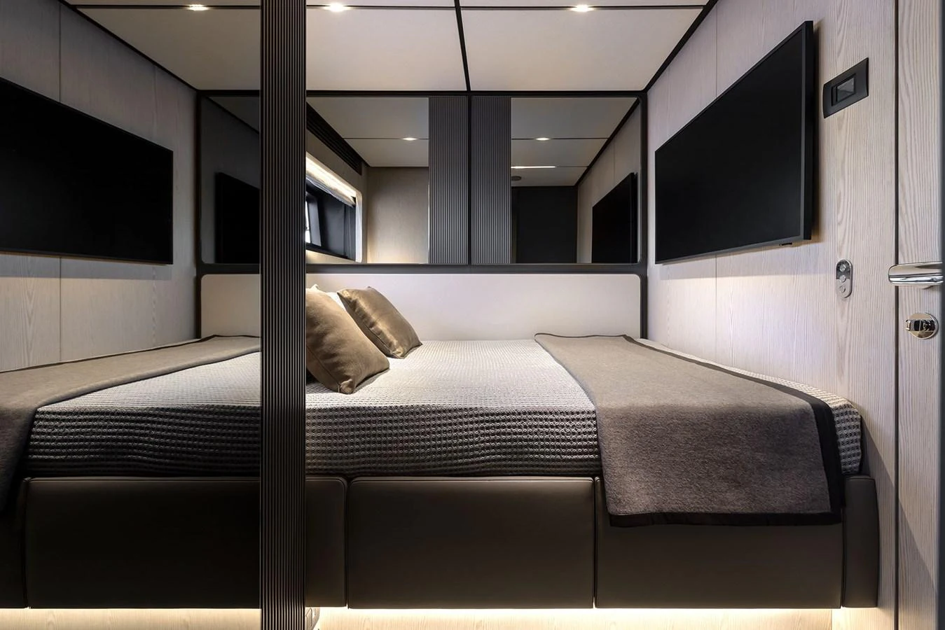The stateroom features a modern design with a cozy bed and ambient lighting. aboard INFYNITO 80 Yacht for Sale