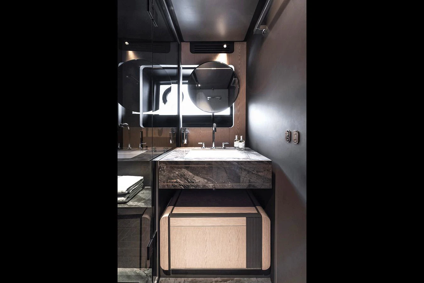 A sleek and modern yacht bathroom with a stylish vanity and contemporary fixtures. aboard INFYNITO 80 Yacht for Sale