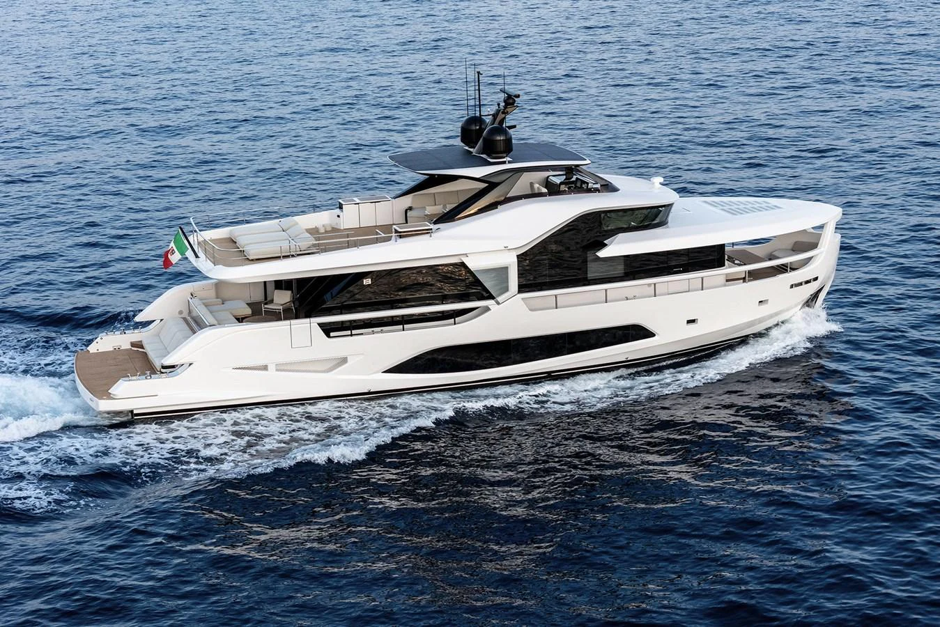 A sleek and modern yacht cruises smoothly on the open water, showcasing its elegant design and spacious decks. aboard INFYNITO 80 Yacht for Sale