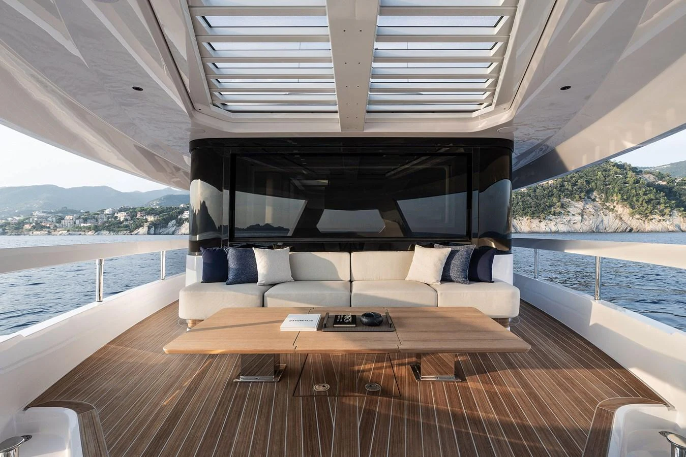 The aft deck features a spacious seating area with a modern design and panoramic views. aboard INFYNITO 80 Yacht for Sale