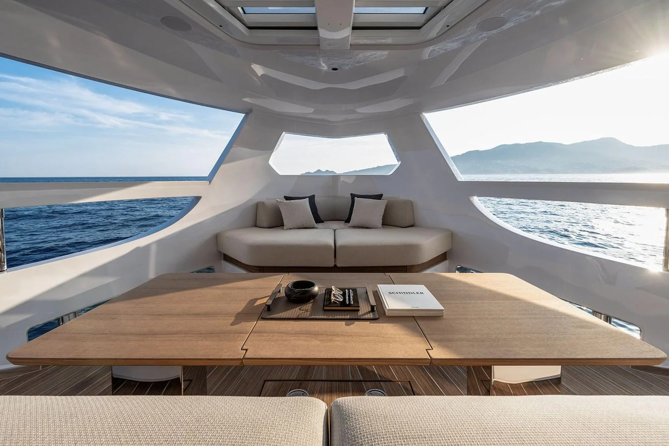 The salon offers a serene and spacious area with panoramic views of the sea. aboard INFYNITO 80 Yacht for Sale