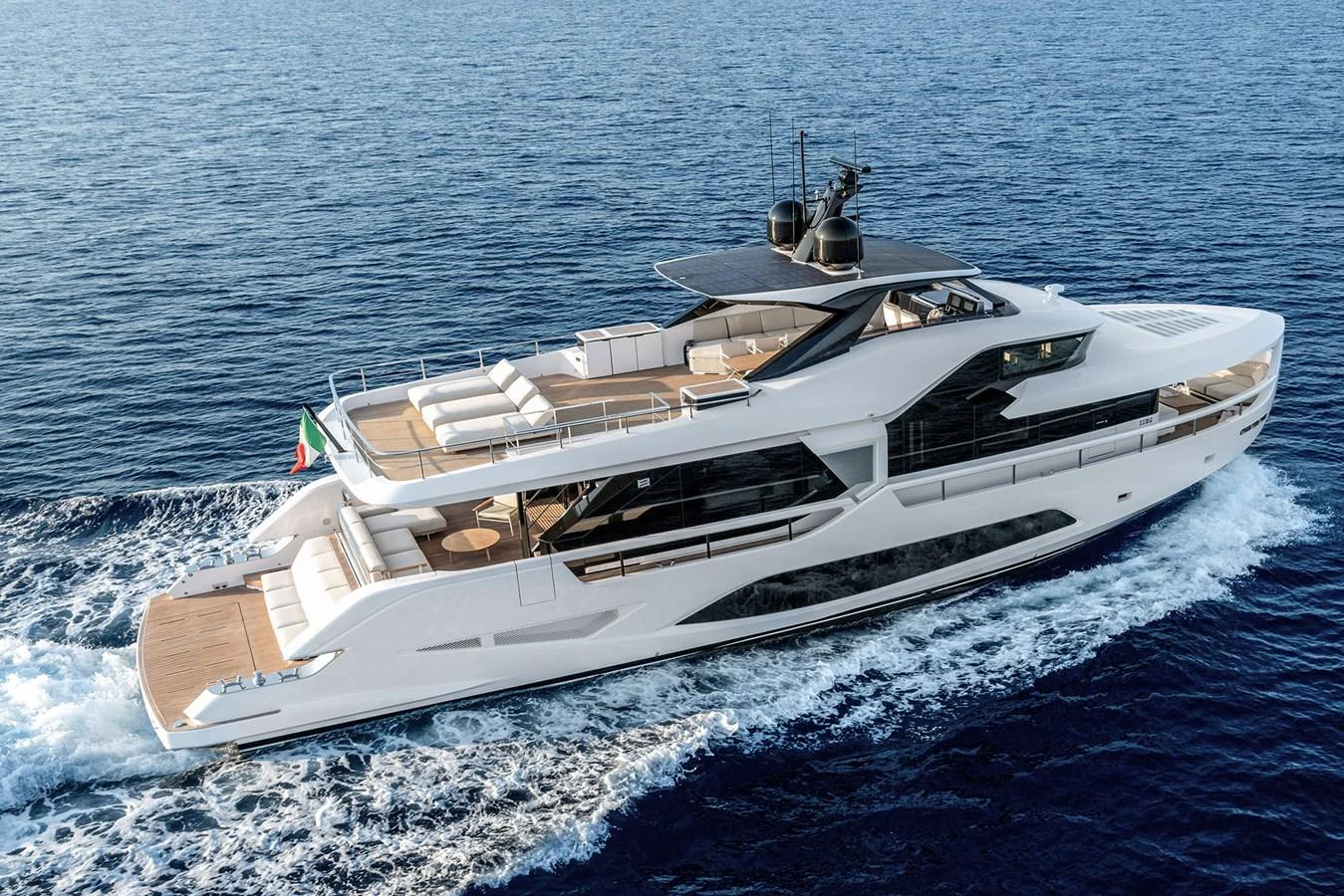 A sleek and modern yacht cruising on open waters, showcasing its luxurious design and spacious decks. aboard INFYNITO 80 Yacht for Sale