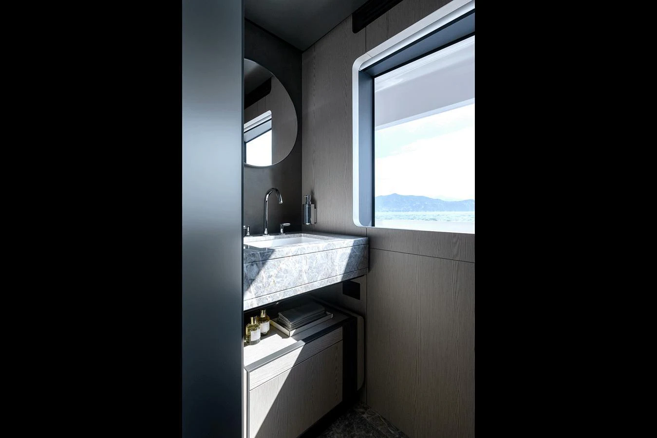 A sleek and modern bathroom with a large window offering a view of the sea. aboard INFYNITO 80 Yacht for Sale