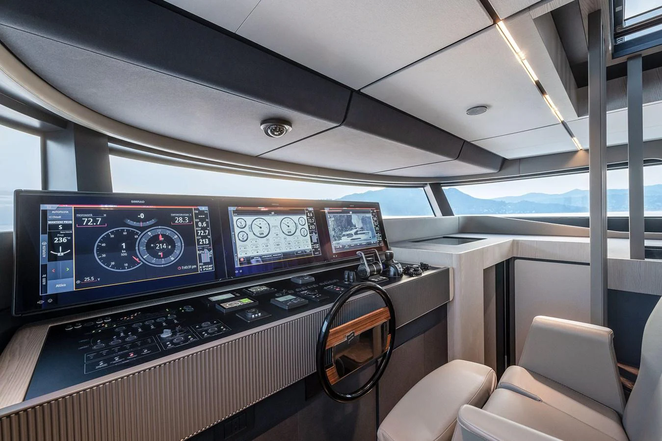 The helm station features advanced navigation equipment and luxurious seating. aboard INFYNITO 80 Yacht for Sale