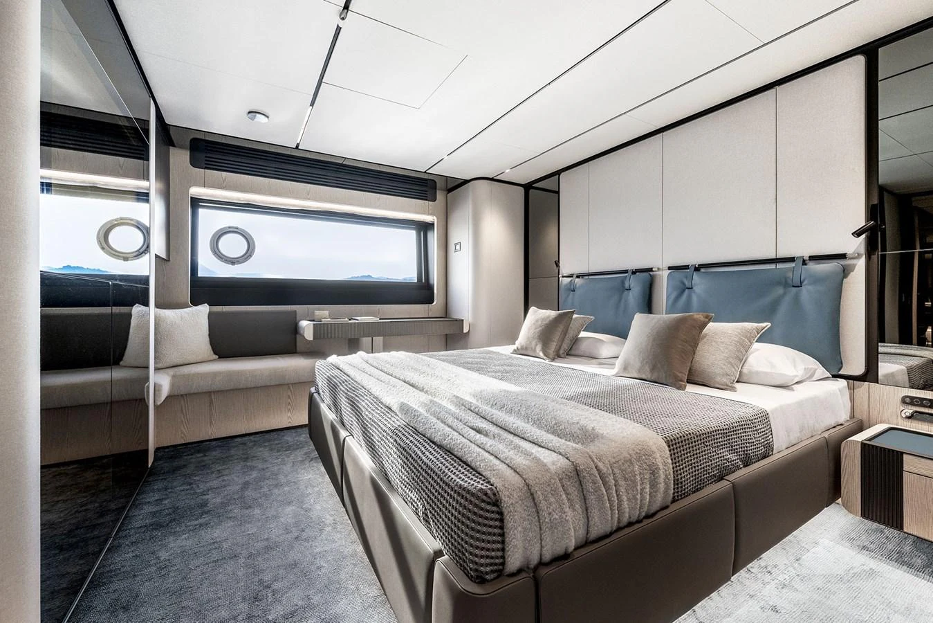 The master stateroom exudes modern elegance with its sleek design and luxurious bedding. aboard INFYNITO 80 Yacht for Sale