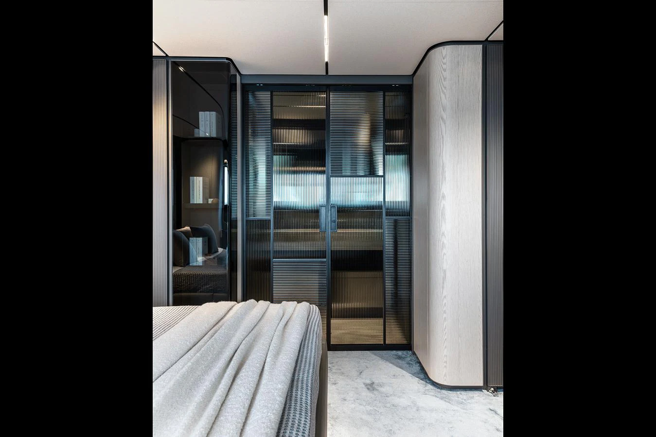 The stateroom features modern design elements with sleek cabinetry and a cozy bed. aboard INFYNITO 80 Yacht for Sale